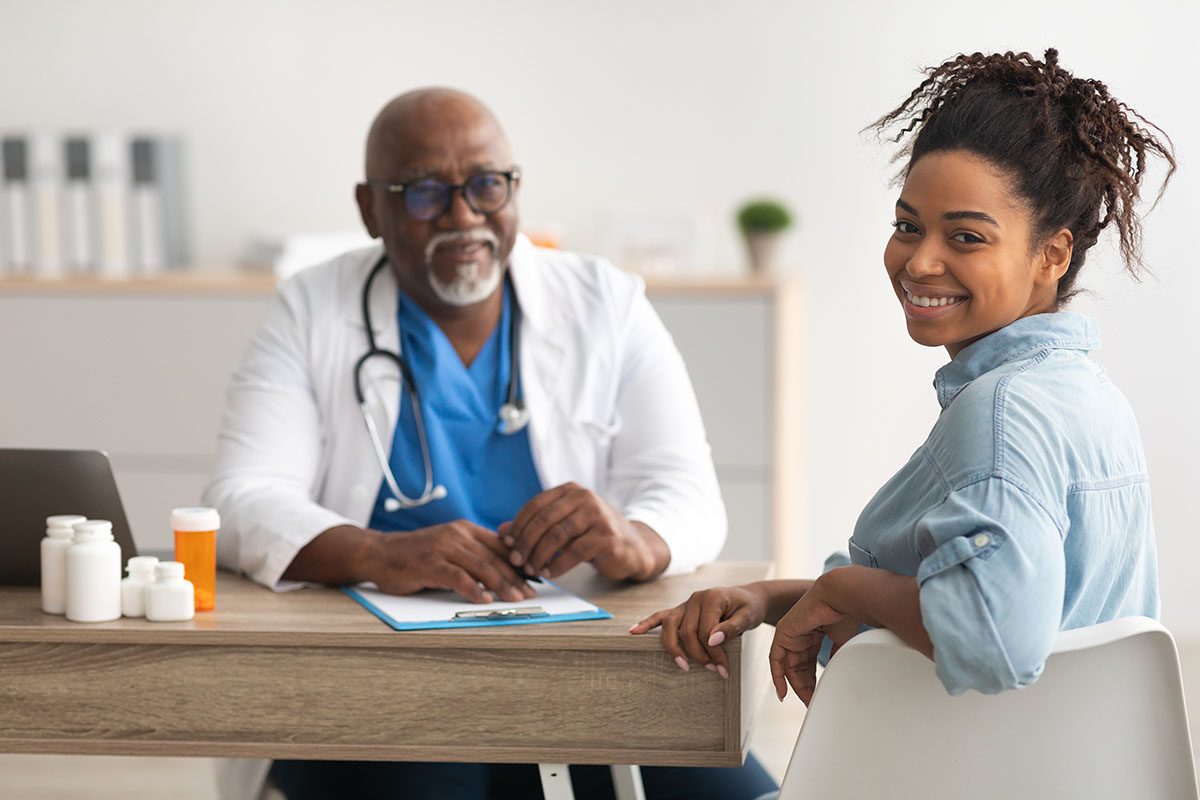 Woman speaking to a Doctor.
